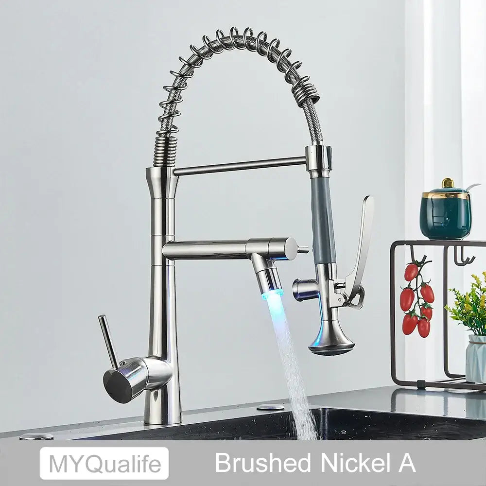 Matte black led kitchen faucet with dual spout mixer featuring brushed nickel flexible coiled hose and illuminated spray head