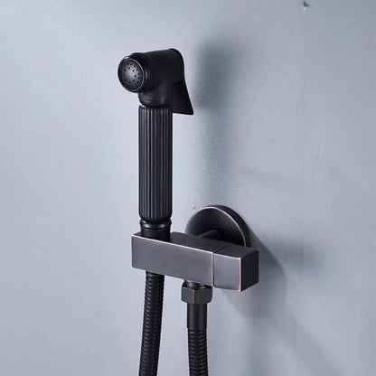 Matte black handheld bidet faucet with ribbed grip and flexible hose designed as a decorbites black bidet spray