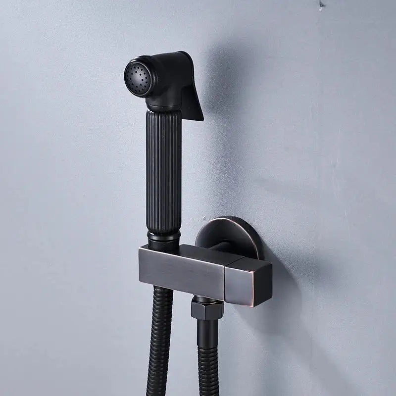 Matte black handheld bidet faucet with ribbed grip and flexible hose designed as a decorbites black bidet spray