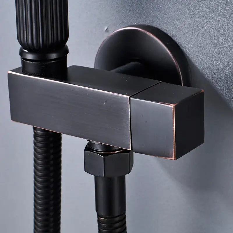 Matte black handheld bidet faucet with ribbed grip featuring a black matte-finished square shower valve and hexagonal nut