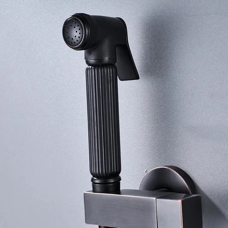 Matte black handheld bidet faucet sprayer with ribbed grip and perforated nozzle mounted on square wall bracket decorbites black bidet