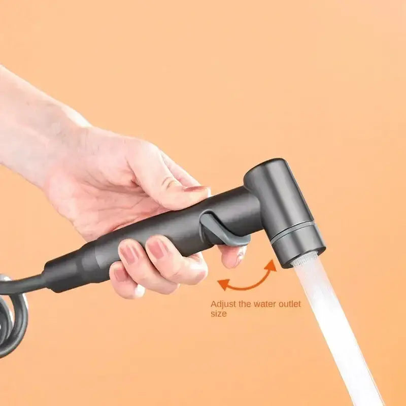 Matte black hygienic bidet sprayer with adjustable water outlet size and coiled hose for bathroom use by decorbites