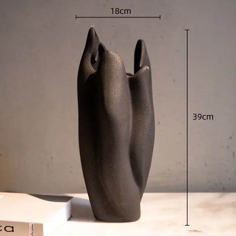 Matte black irregular pleated ceramic vase with sculptural design for living room decorbites irregular pleated decor