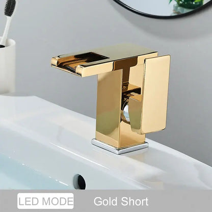 Gold-colored modern short basin faucet with sleek rectangular design and polished metallic finish for decorbites led waterfall