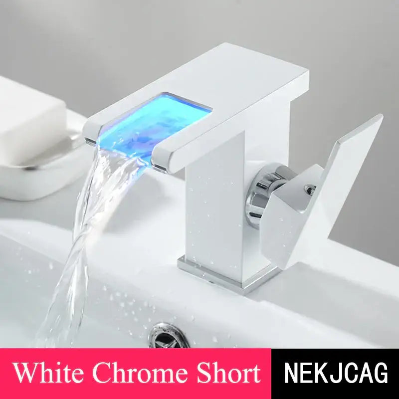 Matte black led waterfall basin faucet with white chrome short spout and glowing blue led decorbites led waterfall feature