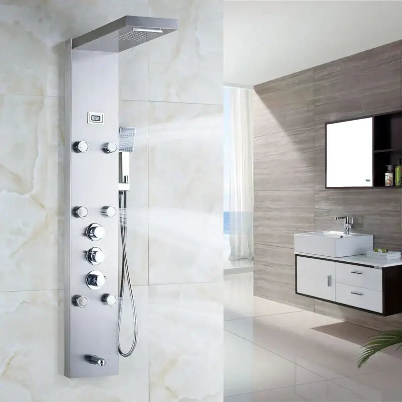 Matte black shower panel with chrome rainfall shower system, multiple control knobs, and black massage jets for decorbites