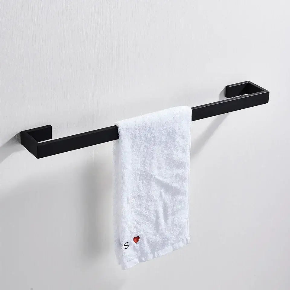 Matte black metal bathroom hardware set featuring a towel rack with rectangular ends holding a white textured towel