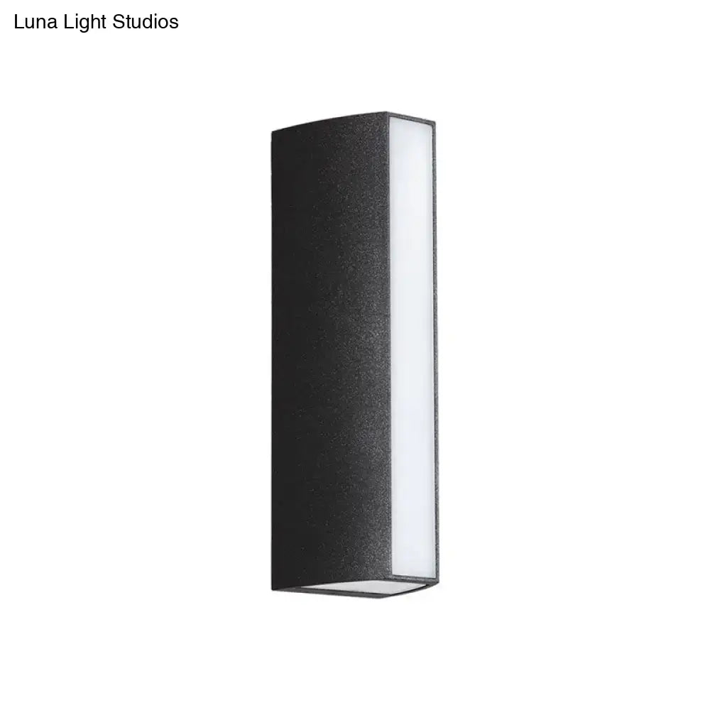 Matte black rectangle outdoor wall light with textured dual directional led sconce and bright white illuminated panel