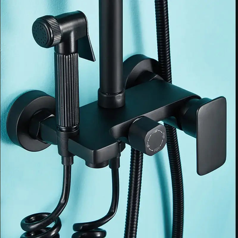 Matte black shower faucet set with handheld sprayer and flexible hose in black matte finish for bathroom use