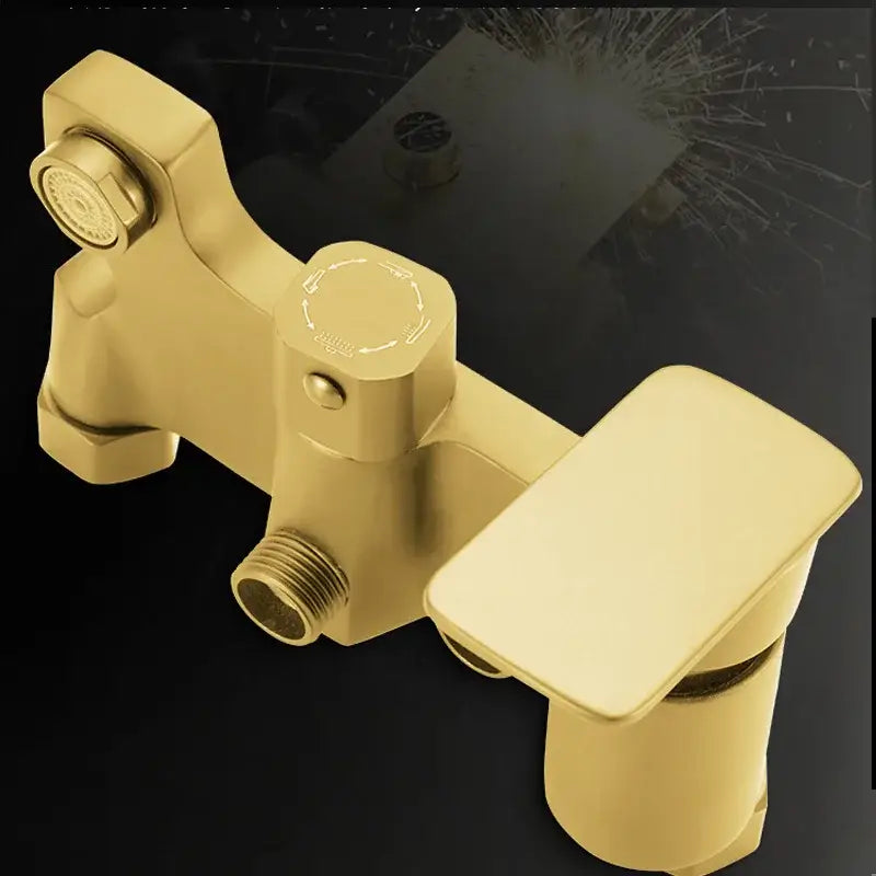 Gold-colored modern shower faucet set with sleek rectangular spout and integrated showerhead for bathroom use