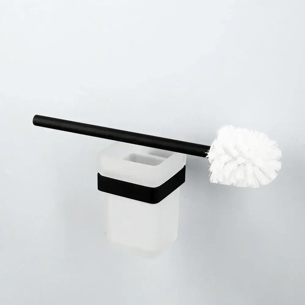 Black and white toilet brush with matte black handle and soft white bristles in a matte black stainless steel bathroom hardware set