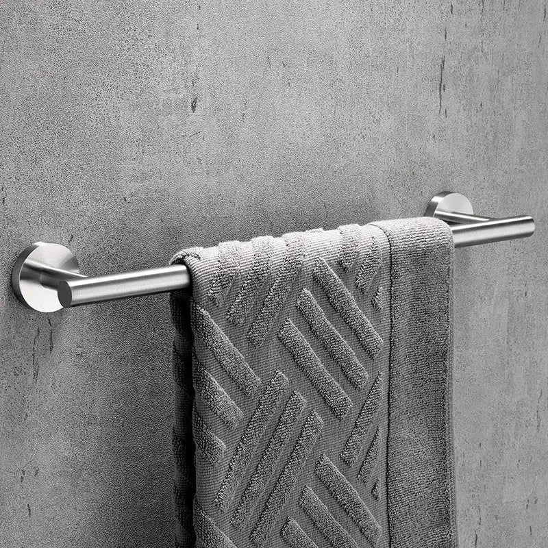 A matte black stainless steel bathroom set with a double towel rack holds a textured gray towel in stainless steel decorbites style