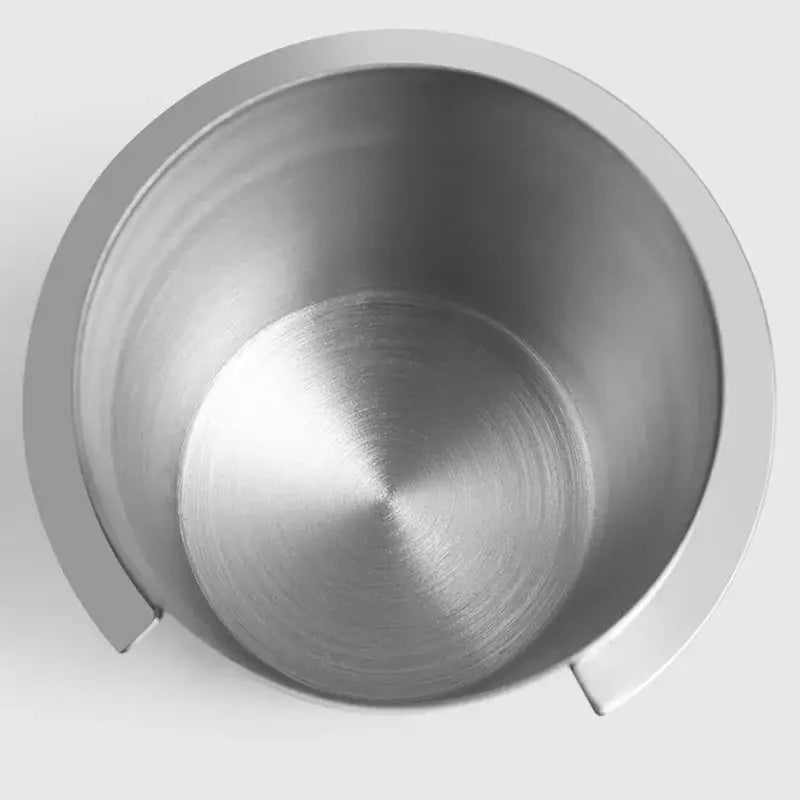 A sleek brushed stainless steel espresso dosing cup with two small notches by decorbites espresso dosing tool