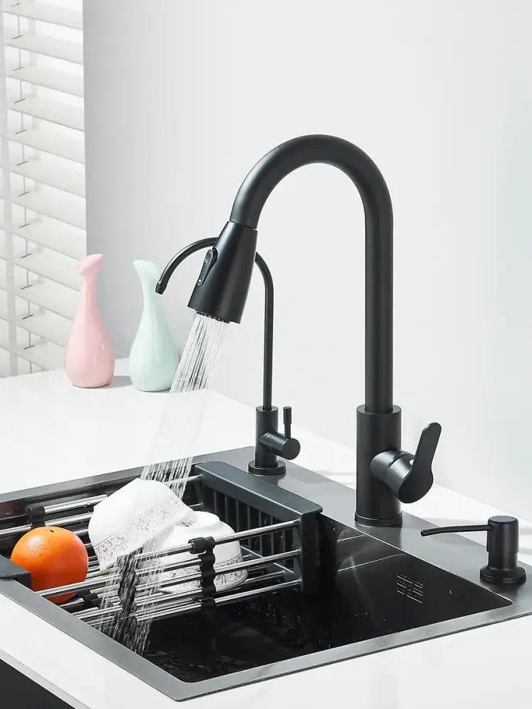 Matte black stainless steel kitchen sink with retractable faucet featuring a black matte-finish pull-down spray head