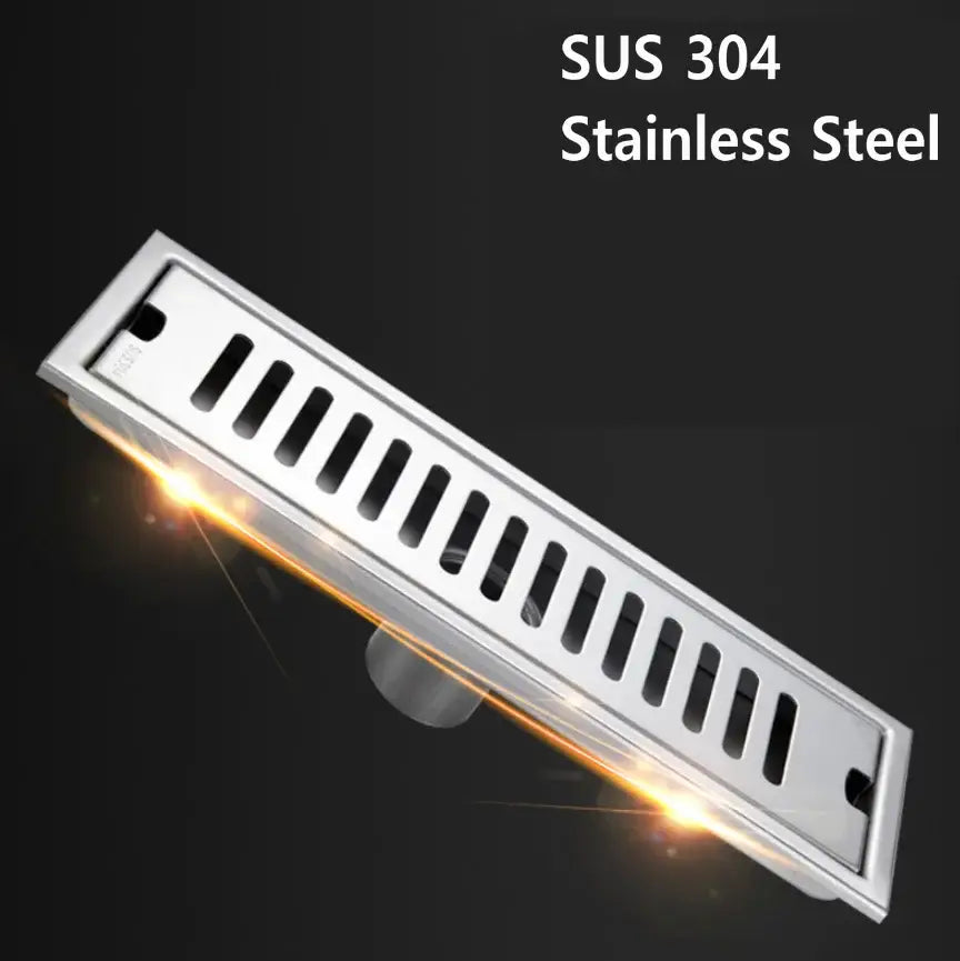 Matte black stainless steel rectangular floor drain with polished silver finish and vertical slits for shower room by decorbites