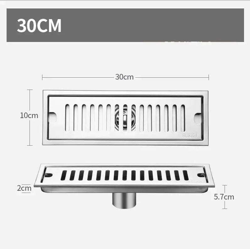 Matte black stainless steel floor drain with slotted design and central circular filter for shower room by decorbites