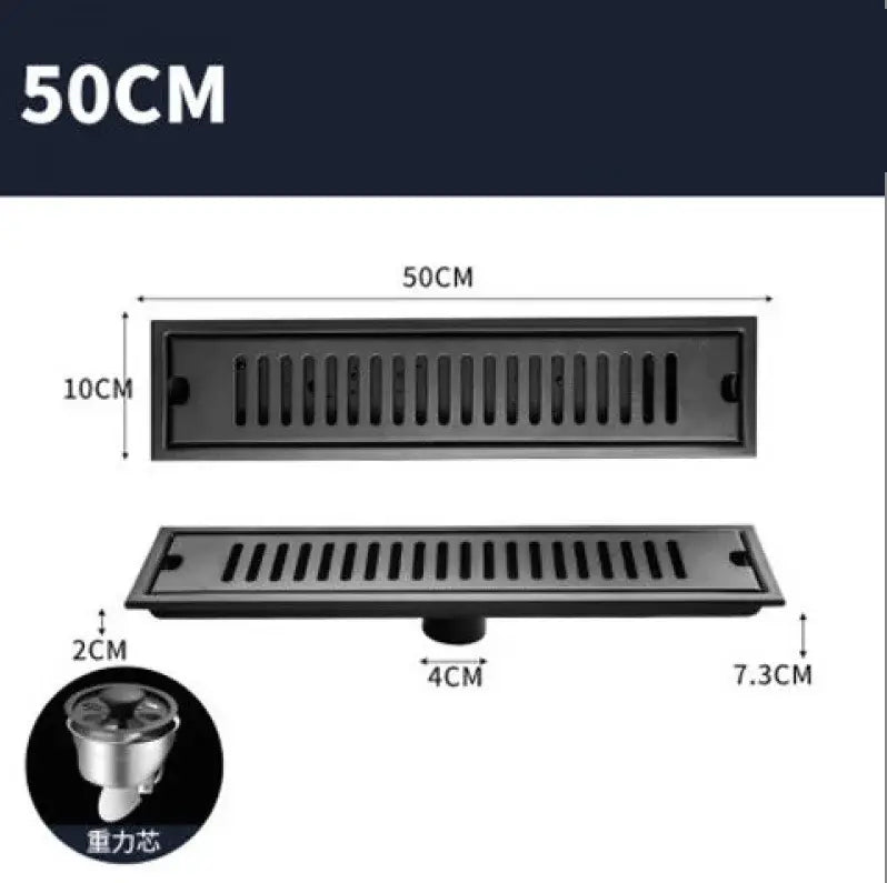 Matte black stainless steel rectangular floor drain with slotted design and gravity-fed strainer by Decorbites