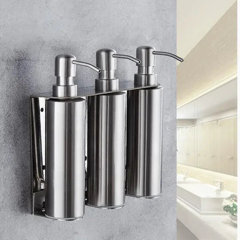 Set of three sleek matte black stainless steel soap dispensers with brushed finish and curved nozzles for bathroom decor