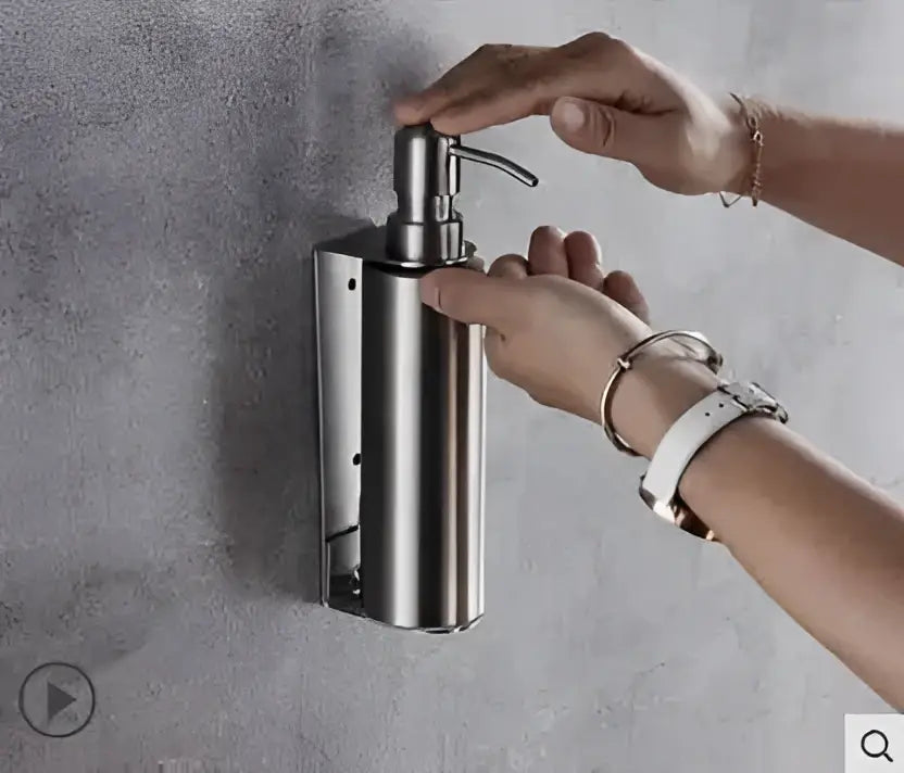 Stainless steel wall-mounted soap dispenser with sleek brushed finish in matte black stainless steel decorbites set