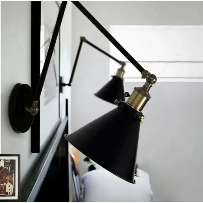 Matte black umbrella wall lights with brass accents featuring black umbrella lampshade and articulated arms for decorbites living room