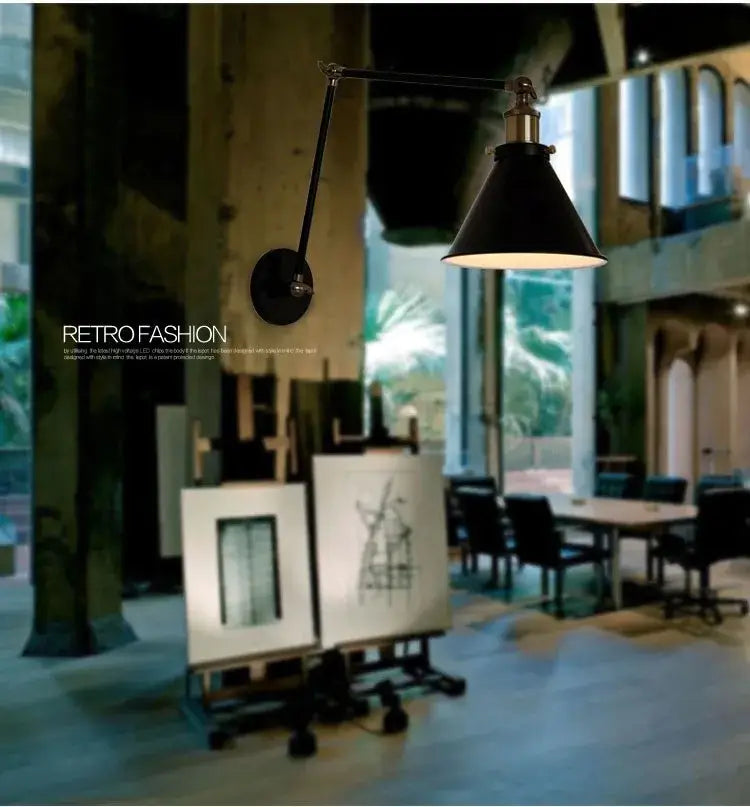 Matte black umbrella wall lights with brass accents featuring a black umbrella lampshade and industrial-style articulated arm