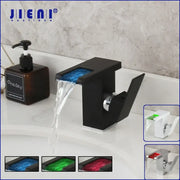 Matte black led waterfall basin faucet with a glowing blue decorbites led waterfall panel for bathroom mixer tap