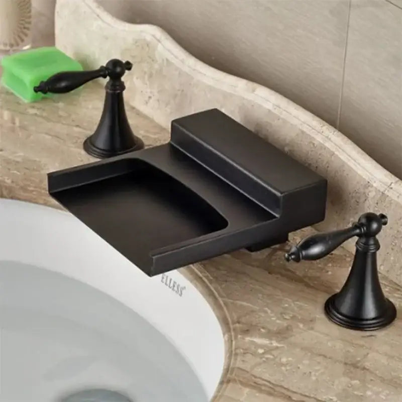 Matte black wide waterfall spout bathroom faucet with black wide waterfall design and square ornate handles in matte finish