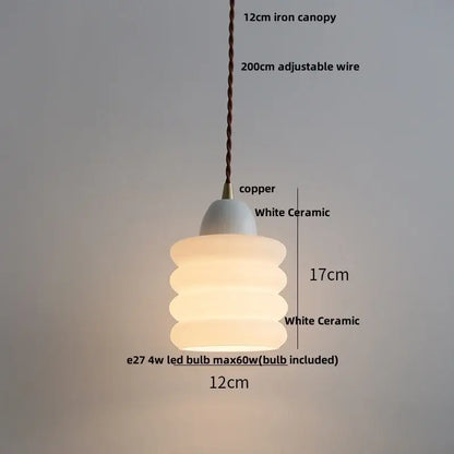 Matte brown and copper ceramic walnut pendant light with white ceramic stacked rounded tiers and copper canopy