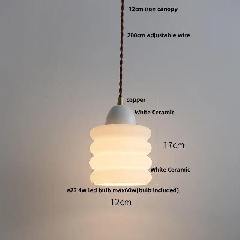 Matte brown and copper ceramic walnut pendant light with white ceramic stacked rounded tiers and copper canopy