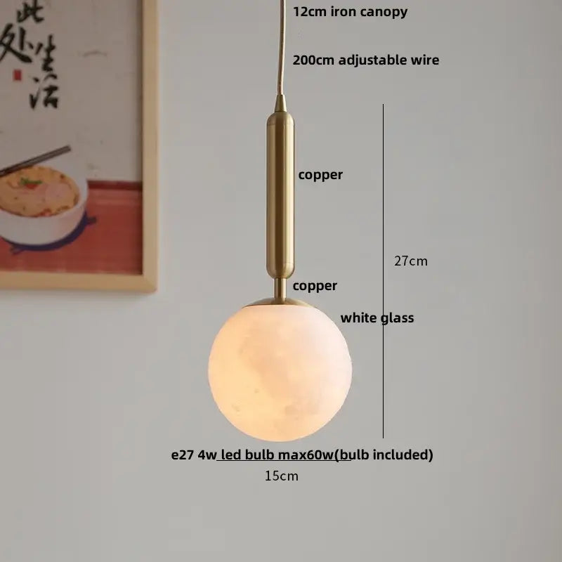 A warm glowing pendant light with a white glass globe and copper ceramic walnut decorbites ceramic walnut finish