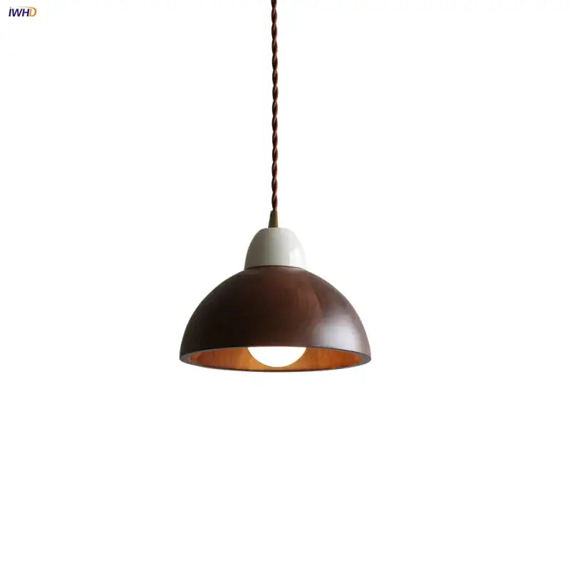 Matte brown and copper ceramic walnut pendant light with a dome shape and twisted bronze cord for kitchen decorbites pendant light