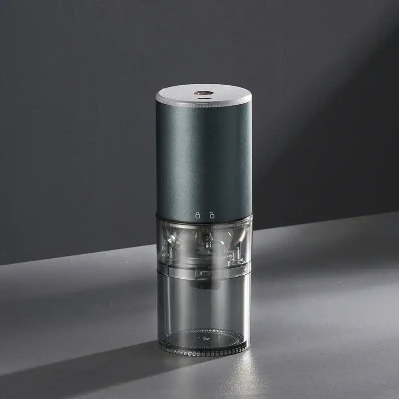Matte dark teal electric coffee bean grinder with matte body and transparent glass for efficient electric coffee grinding