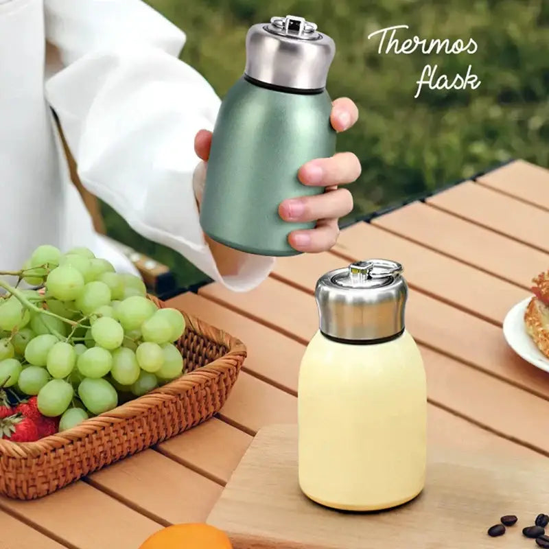 Matte pastel sage green stainless steel vacuum flask with polished lid ideal for kitchen and travel use water bottle