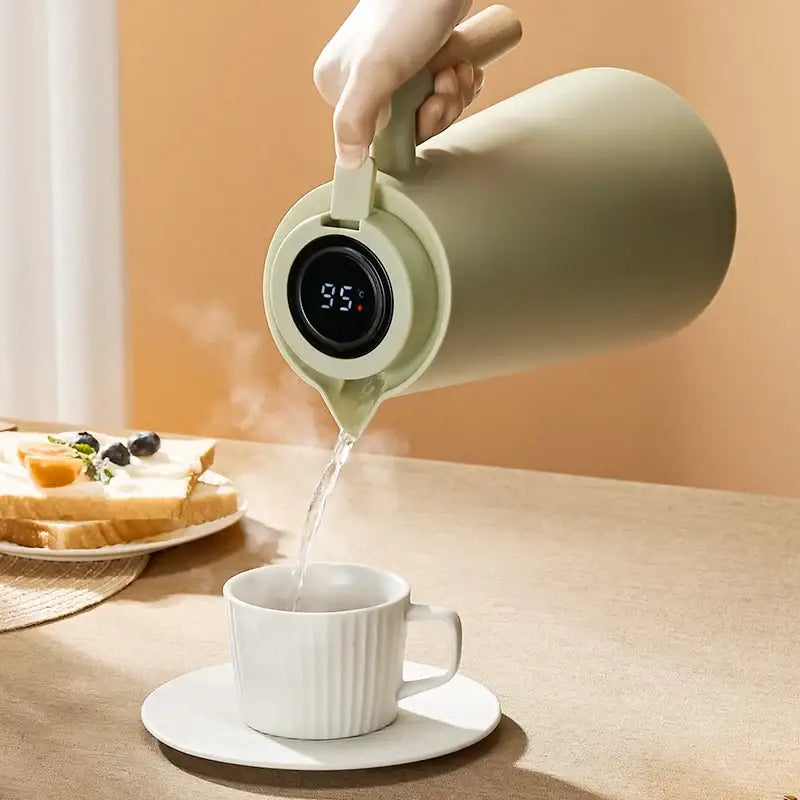 Matte sage green decorbites insulation kettle thermos bottle pouring steaming water with digital temperature display