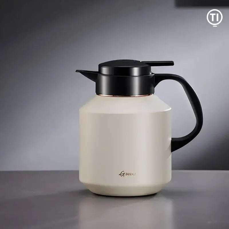 Cream-colored matte stainless steel insulation pot with black lid handle and rose gold trim by decorbites insulation pot