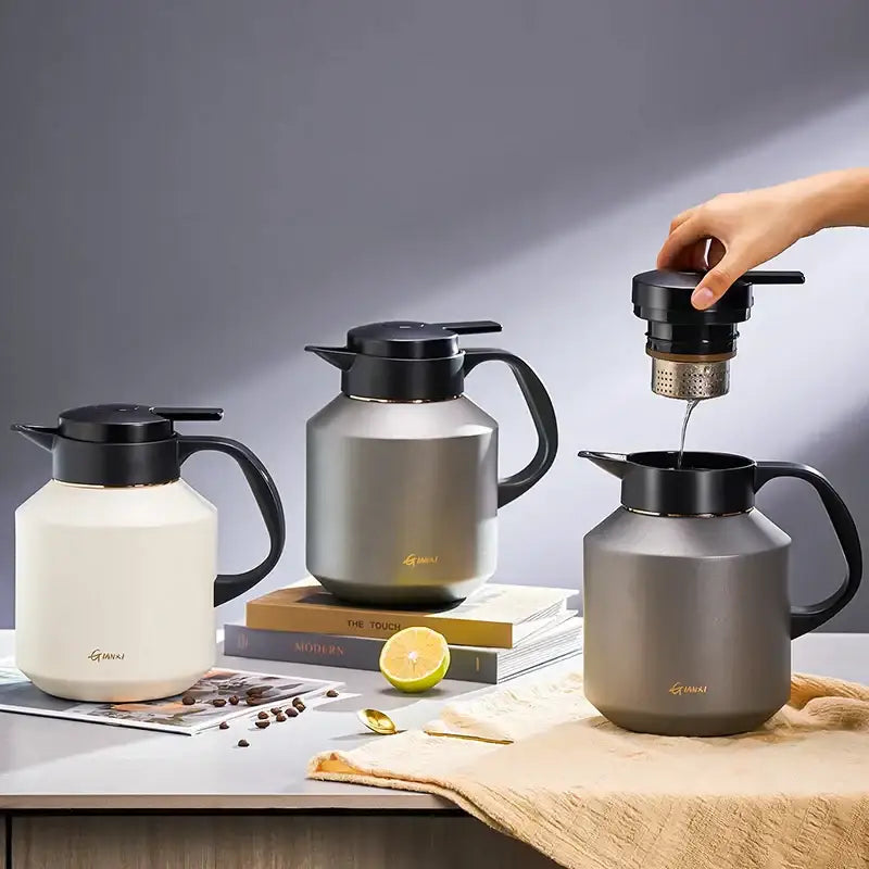 Three sleek matte white and metallic gray decorbites insulation pot thermal carafes with black handles and lids