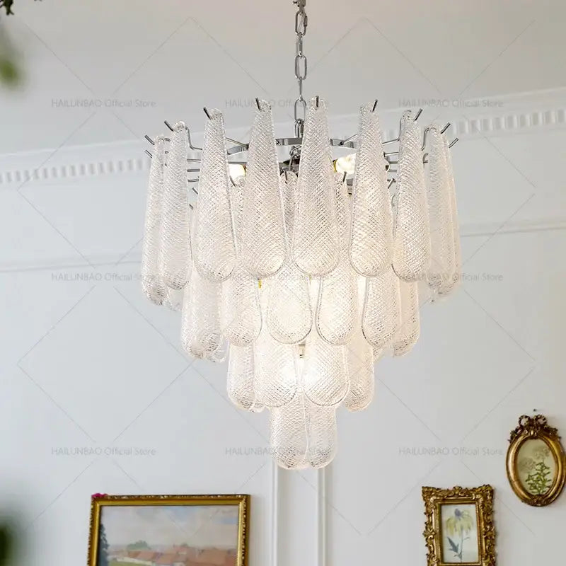 Elegant medieval cascading crystal glass chandelier with textured teardrop shades and polished chrome frame for dining room decorbites crystal glass