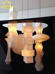 Elegant white akari noguchi yong pendant lights with warm glowing rice paper and geometric design for home decor