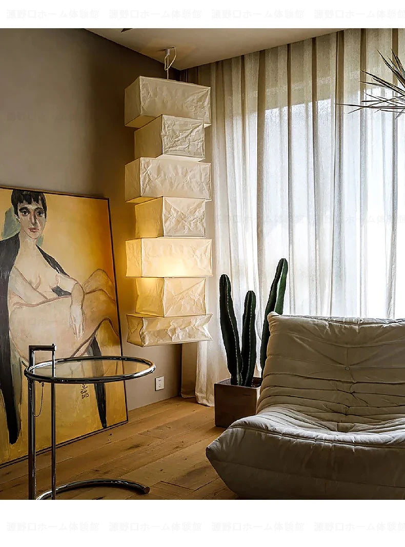 Stacked cream-colored pendant lights made from rice paper by akari noguchi yong for modern home decor