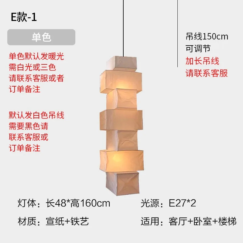 A warm tiered paper and iron pendant light with stacked cube design for home decor by akari noguchi yong