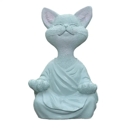 A serene light blue resin buddha cat figurine in a flowing robe with soft pink ears for living room decorbites black buddha decor