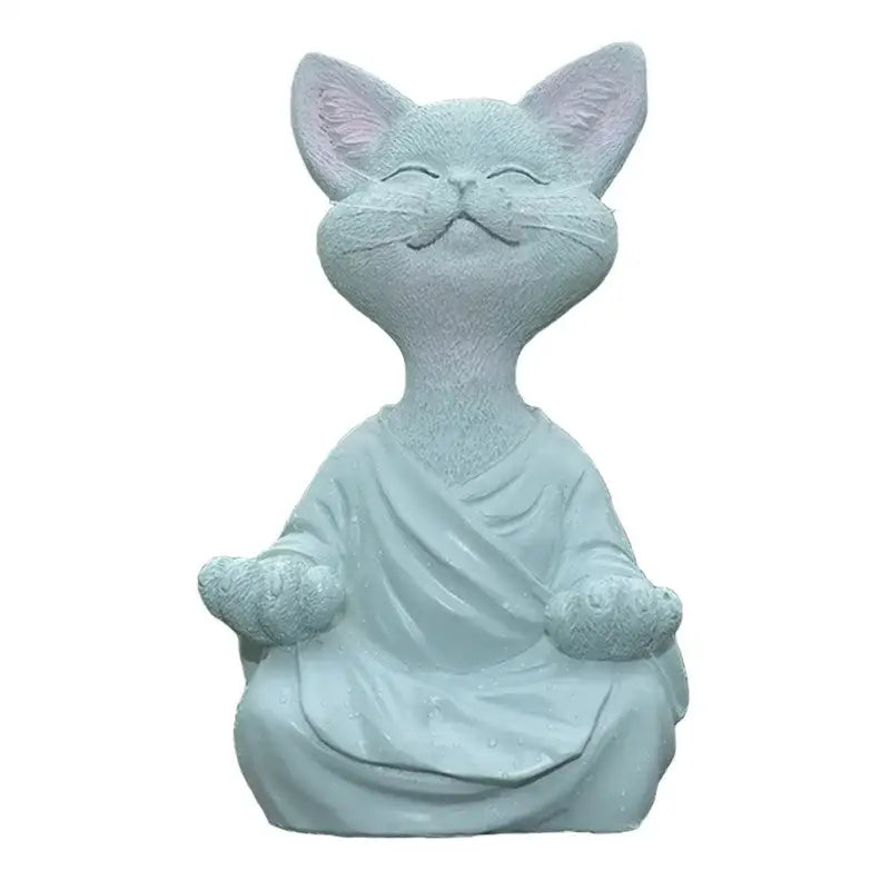 A serene light blue resin buddha cat figurine in a flowing robe with soft pink ears for living room decorbites black buddha decor