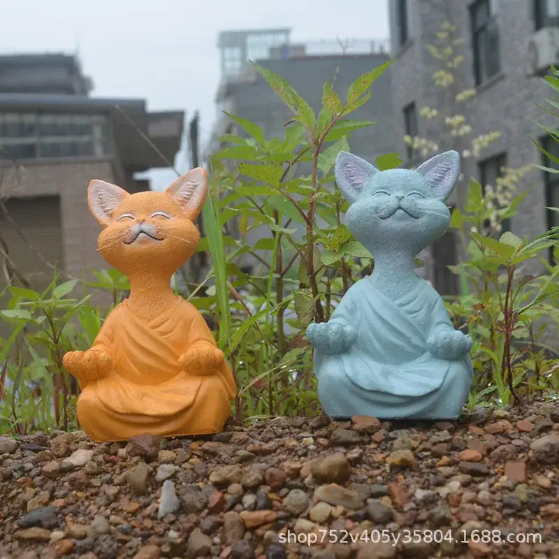 Two ceramic meditative buddha cat figurines in orange and light blue for living room decorbites black buddha set