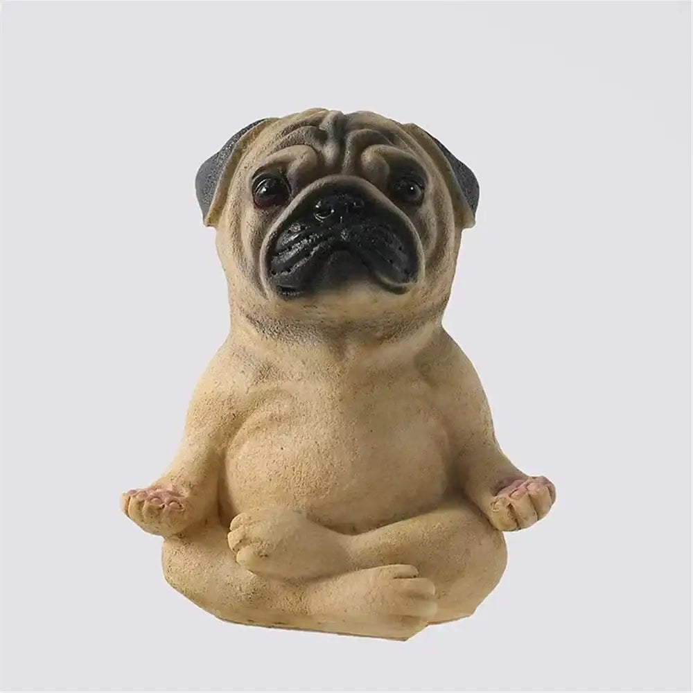 A beige decorbites bulldog resin statue in a meditative pose with black facial features and gray ears for garden decor