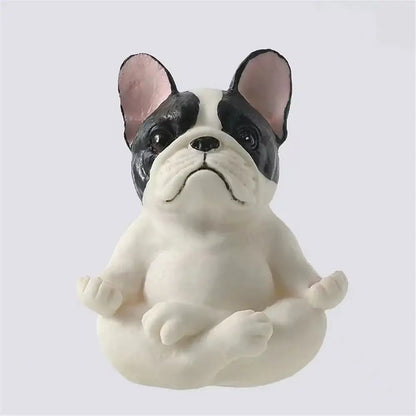 A black and white meditative bulldog resin statue with pink ears from decorbites bulldog resin garden decor set