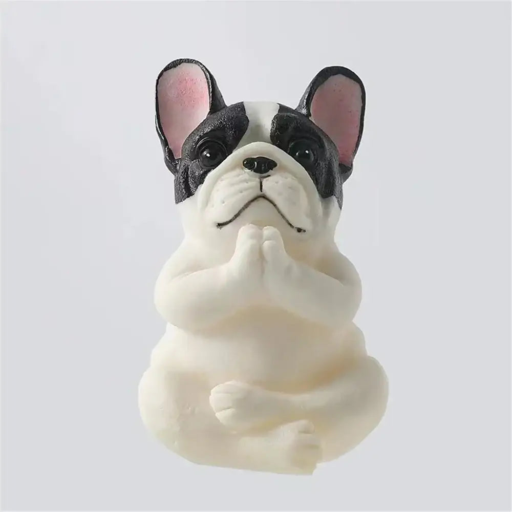 A charming black and white meditative bulldog resin statue with pink ears from decorbites bulldog resin set