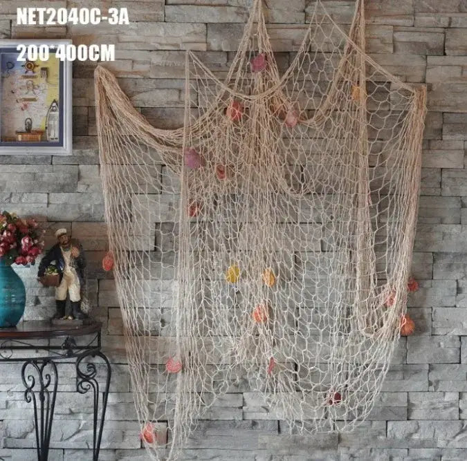 Mediterranean beige decorative fishing net wall hanging with orange and pink floats for living room decorbites decor