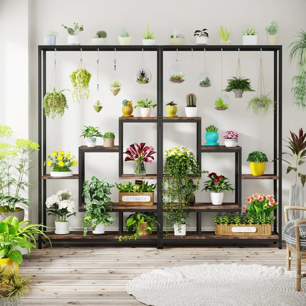 Black metal and wood decorbites 5-tier tall plant stand with hanging hooks holding colorful potted plants