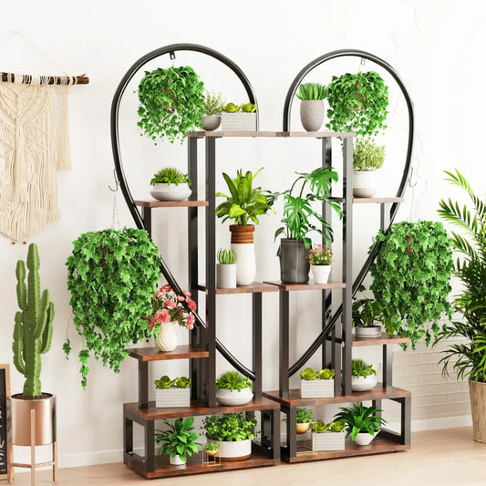 Decorbites 6-tier half heart metal plant stand in black metal and wood with multiple shelves holding potted plants