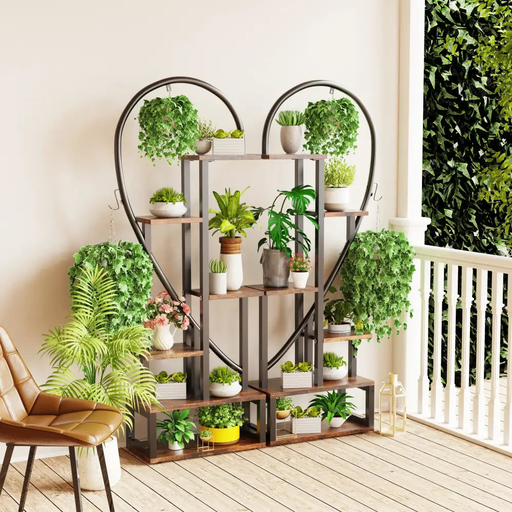 Decorbites 6-tier half heart metal plant stand with wooden shelves and hanging hooks holding white ceramic pots